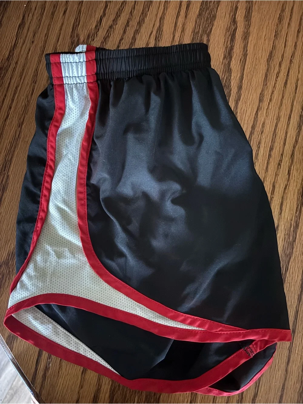 Nike Black Athletic Shorts with Red Trim and White Panels